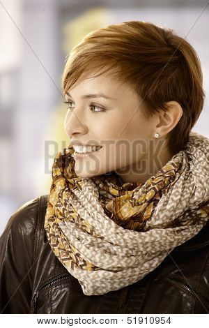 Profile portrait of Young woman wearing scarf and leather jacket