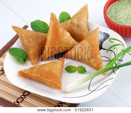 samosa in white dish