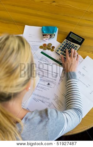 a woman with unpaid bills has many debts. unemployment and personal bankruptcy