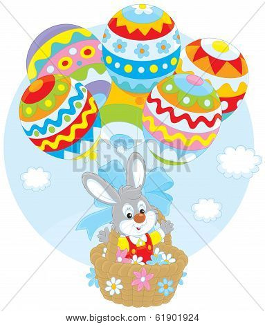 Easter Bunny flies with balloons