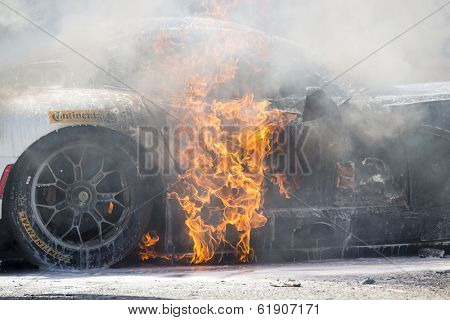 Sebring, FL - Mar 15, 2014:  The Riley Motorsport Dodge ViperExchange.com goes up in flames after a crash early in the 12 Hours of Sebring at Sebring International Raceway in Sebring, FL.