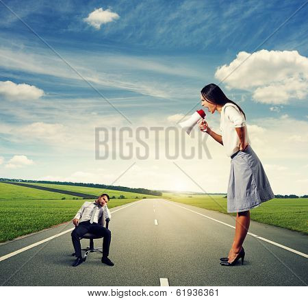 angry young woman and tired young man on the road