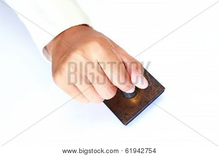 Worker Hand Holding Rubber Stamp