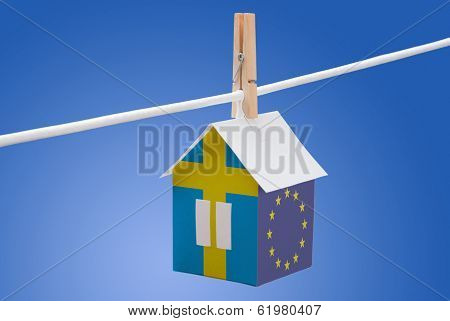 sweden, swedish and EU flag on paper house