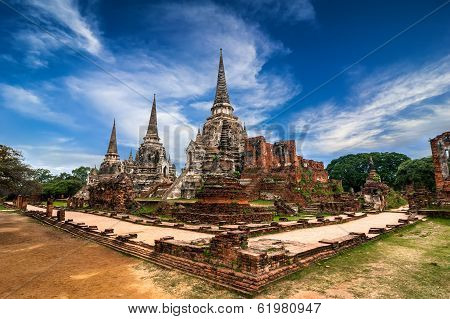 Ancient pagoda at Wat Phra Sri Sanphet temple under blue sky. Ayutthaya Thailand