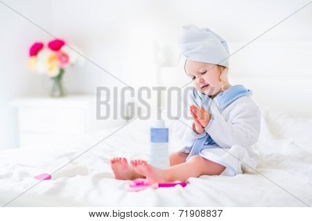 Litlte Girl In A Bathrobe And Towel