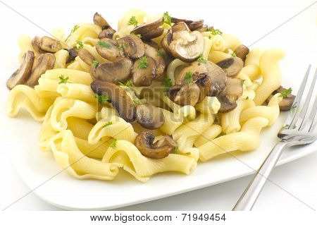 Gigli Con Funghi pasta dish with chopped parsley leaves