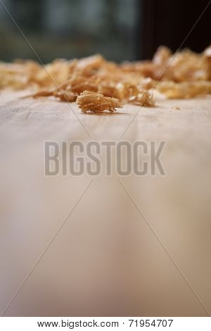 Chip Shavings with Spokeshave of Sapele Hardwood Board