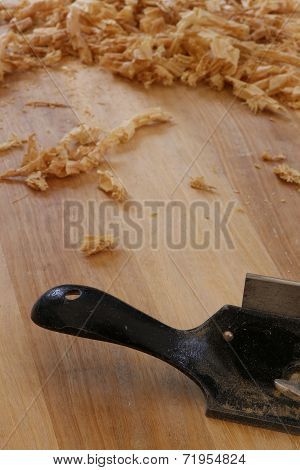 Chip Shavings with Spokeshave of Sapele Hardwood Board