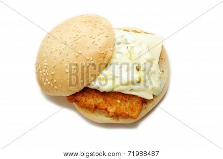 A Fish Sandwich Covered With Tartar Sauce