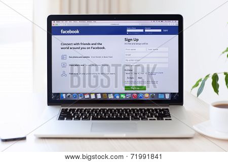 Laptop Macbook Pro Retina With Site Facebook On The Screen Is On The Table In The Office