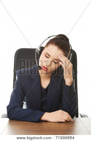 Portrait of anoyed support phone operator in headset