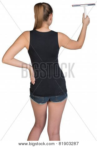 Woman using squeegee. Rear view