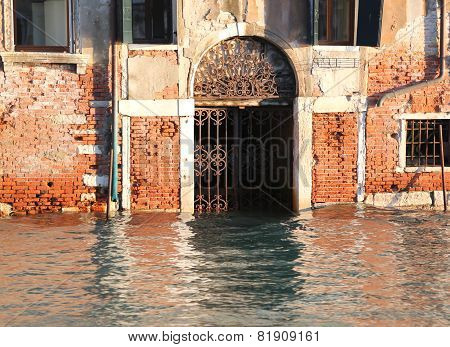 House With The Water In The Door At High Tide In Venice In Italy
