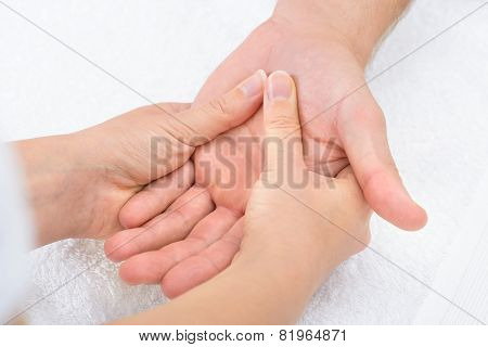 Physiotherapist Massaging Palm