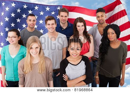 Portrait Of College Students Standing In Classroom