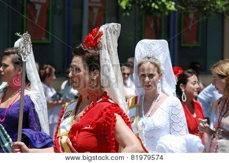 Spanish women in traditional dress.