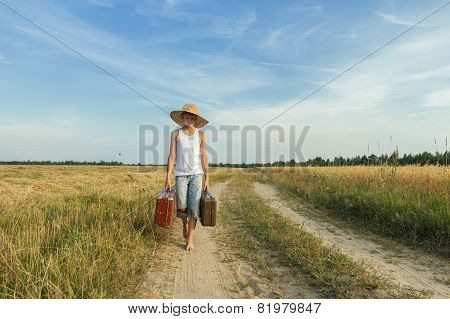 Teenage Boy Traveling By Foot On Country Road