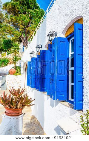 Iconic blue wooden shutters in Greece