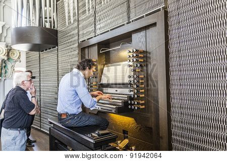 People Watch The Organ Player In The Jesuiten Church