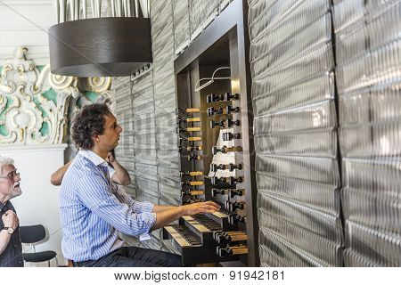 People Watch The Organ Player In The Jesuiten Church