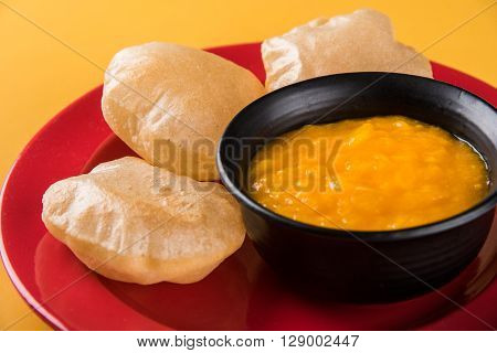 Aamras or Aam Ras Puri: Puri which is an indian fried small bread and alphonso mango pulp is a popular lunch especially during Padwa, the Marathi new year, maharashtrian lunch/dinner menu
