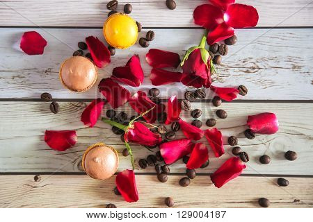 Natural french macaruns and red roses pentals on flat
