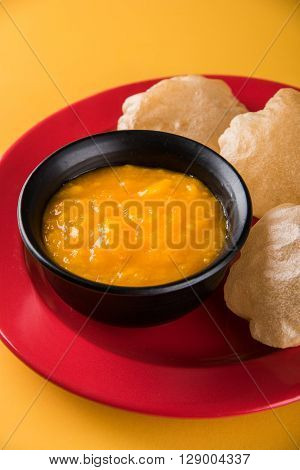 Aamras or Aam Ras Puri: Puri which is an indian fried small bread and alphonso mango pulp is a popular lunch especially during Padwa, the Marathi new year, maharashtrian lunch/dinner menu