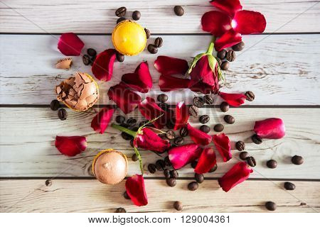 Natural french macaruns and red roses pentals on flat