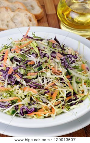 Salad coleslaw red and white cabbage with carrots and cucumber
