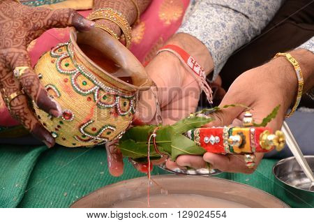Bride And Groom Performing Indian Rituals For Wedding