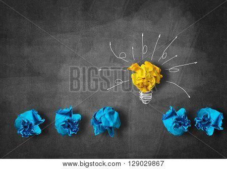 Inspiration concept with crumpled paper light bulb as good idea