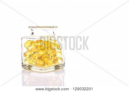 Fish Oil Capsules In Translucent Bottle On White Background