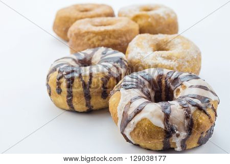 Various dougnuts close up isolated on white background