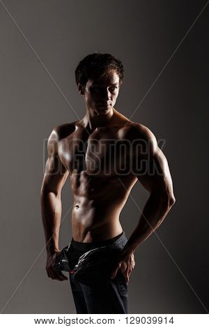 Muscular Male Model Bodybuilder Before Training. Studio Shot On Gray Background. Fitness Model. Grea