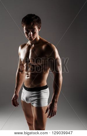 Strong Athletic Man Showing Muscular Body And Sixpack Abs. Showing His Body. Fitness Model. Great Fo