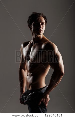 Muscular Male Model Bodybuilder Before Training. Studio Shot On Gray Background. Fitness Model. Grea