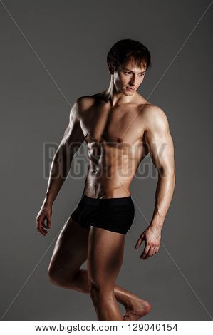 Muscular Male Model Bodybuilder Before Training. Studio Shot On Gray Background. Fitness Model. Grea