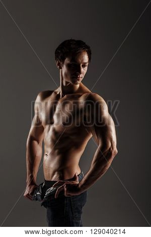 Muscular Male Model Bodybuilder Before Training. Studio Shot On Gray Background. Fitness Model. Grea