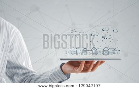 Hand of businessman demostrating tablet and construction concept on screen
