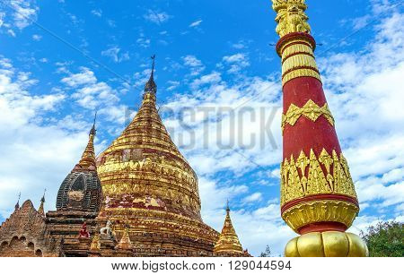 Myanmar, Bagan, the golden pagoda in the plain with thousand of 880-year old temple ruins.