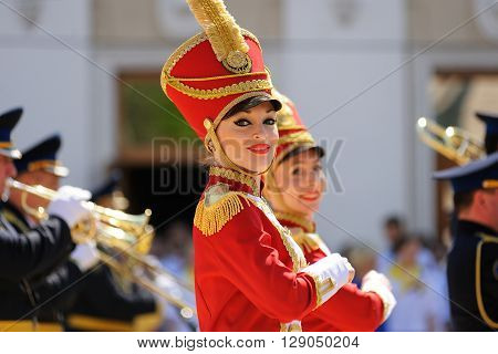 Orel Russia - May 9 2016: Celebration of 71th anniversary of the Victory Day (WWII). Girls in red hussar uniform marching closeup