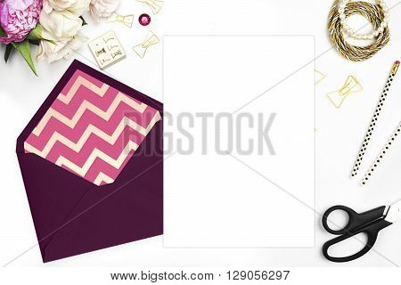 Feminine scene. Glamour style. Gold and stationery items on white table. View up. Flat lay. Wedding template invitation. Place your text or your artworks. bouquet of flowers, peonies with the tulips.
Feminine scene. Glamour style. Gold and stationery item
