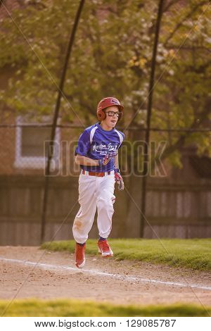 Morton Grove, IL, USA - 05.06.2106. Youth Baseball Match between Norwood Park Team and Morton Grove Park Team took place in Morton Grove, IL on 05.06.2016