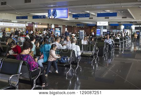 Hanoi, Vietnam - Apr 21, 2015: Passenger waiting for being called on board at the waiting room in Noi Bai International Airport, 30km from the center of Hanoi capital city.