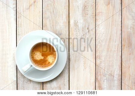 Espresso In The Cup On The Wooden Background