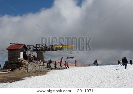 SERRA DA ESTRELA, PORTUGAL - APRIL 24, 2016: People on the mountain ski resort in Serra da Estrela. Serra da Estrela is the only ski resort in Portugal, in April 2016. Serra da Estrela, Portugal