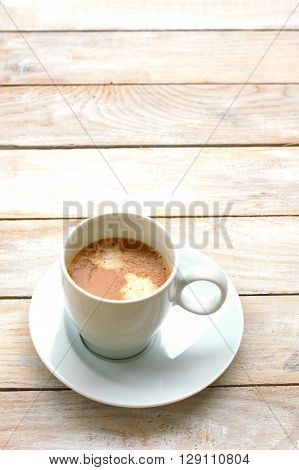 Espresso In The Cup On The Wooden Background