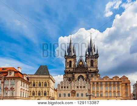 Old Town of Prague buildings, Czech Republic. View on Tyn Church and historic colorful tenement houses, blue sky.