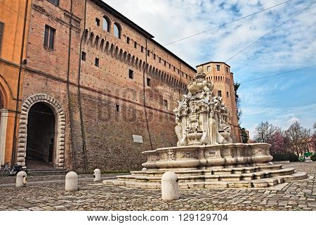 the ancient fountain Fontana del Masini (16th century) and the fortified palace Rocchetta di Piazza (15th Century) in the historic centre of Cesena, Emilia romagna, Italy